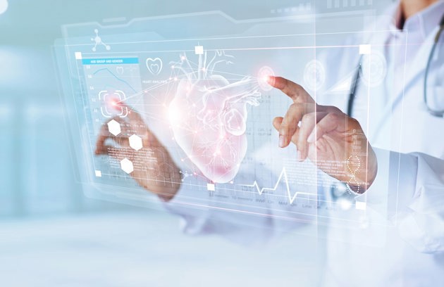 A Cardiology Specialist in Sharjah explaining heart function using advanced medical technology.
