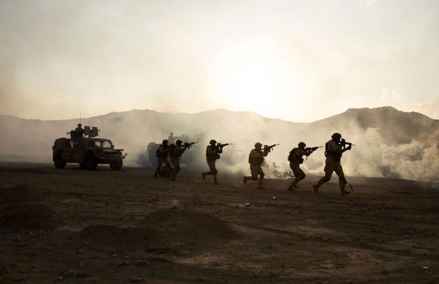 Military personnel participating in a field training exercise representing National Service Screening in Sharjah.