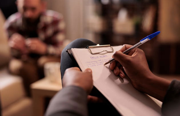 A patient attending a confidential therapy session with a mental health professional at a Psychiatric Clinic in Sharjah.
